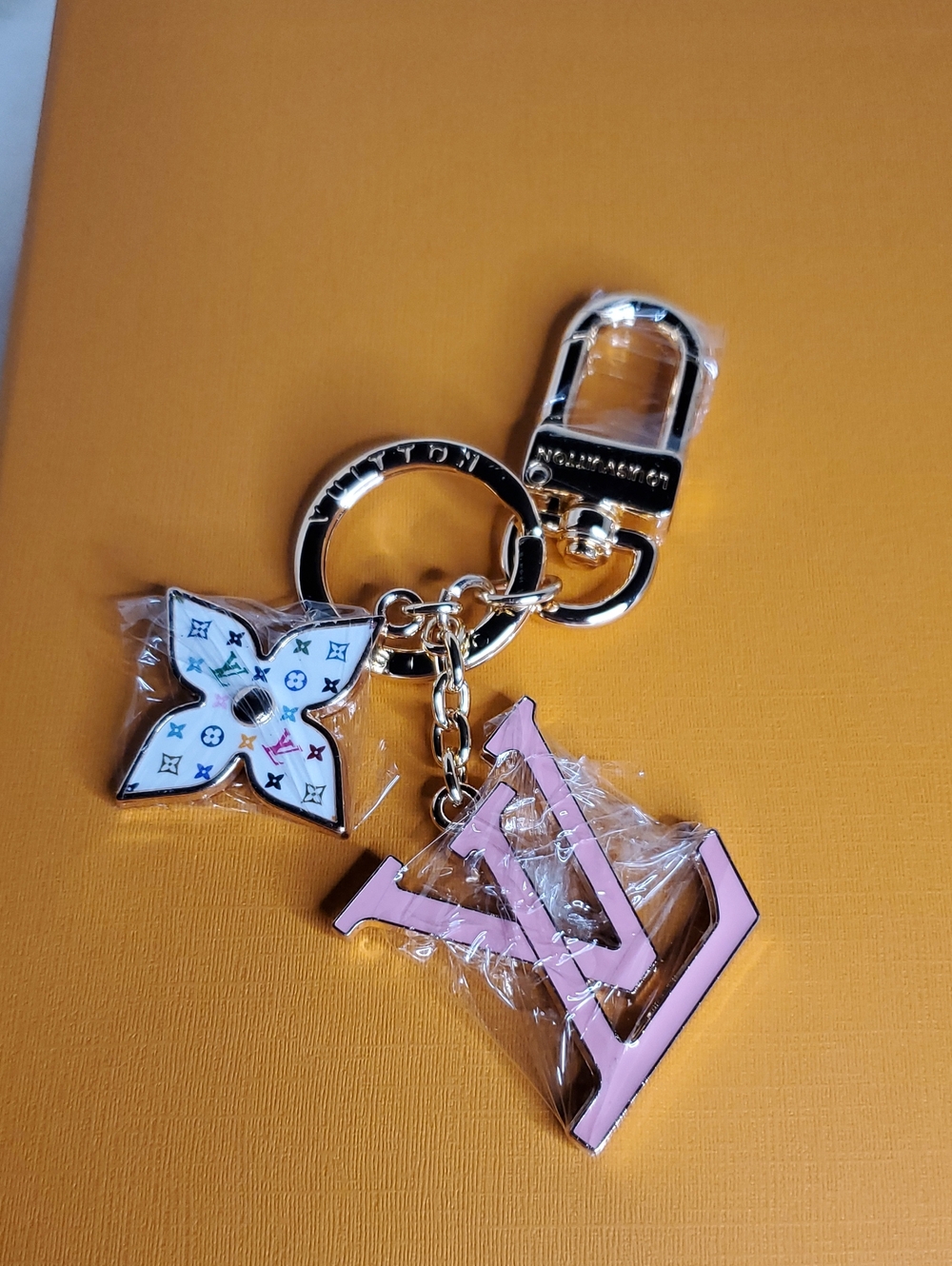 Source Unknown Pink Monogram-Style Key Charm with White Floral Accent